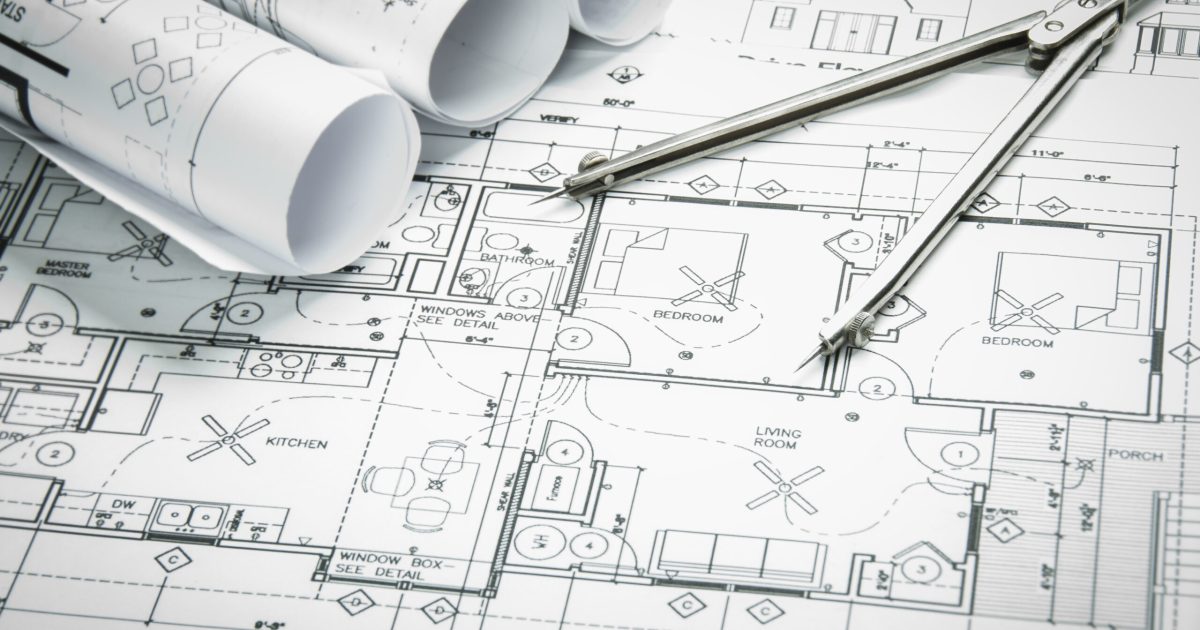 Architectural,Blueprints,And,Blueprint,Rolls,And,A,Drawing,Instruments,On